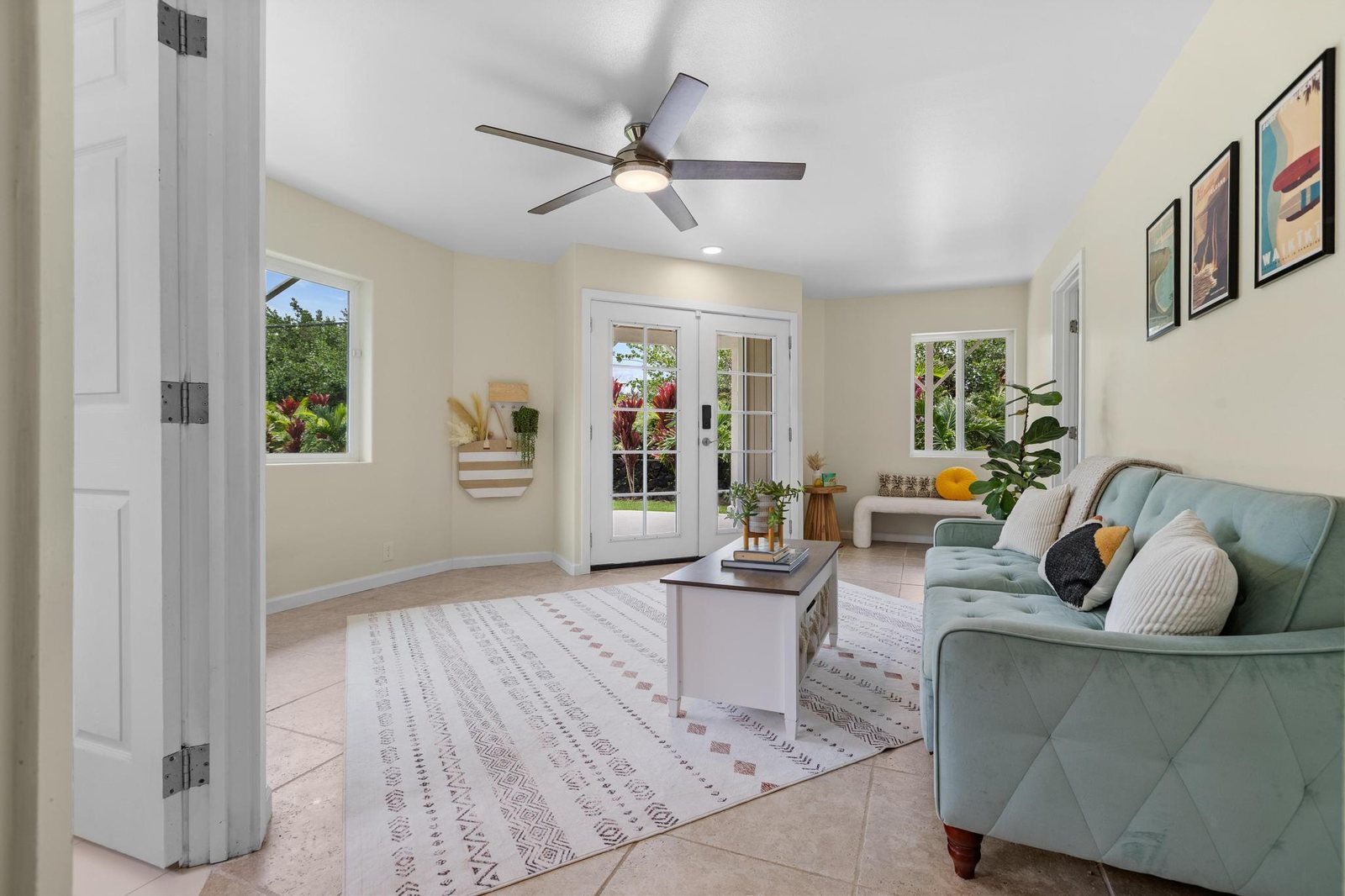 Garden-level living room with tile floors and garden views
