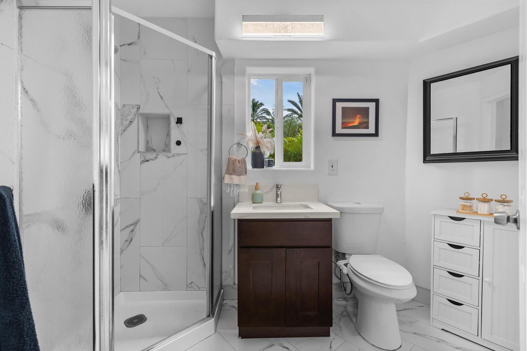 Garden-level full bath with glass shower