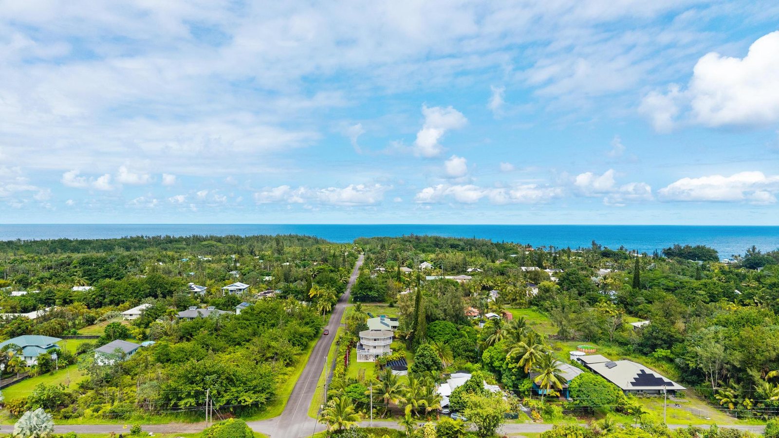 Aerial view over the neighborhood to the ocean